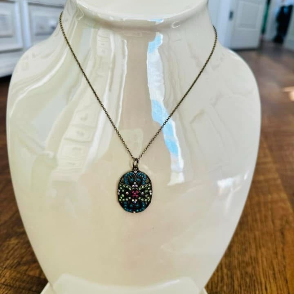 Vintage necklace on antique gold chain.